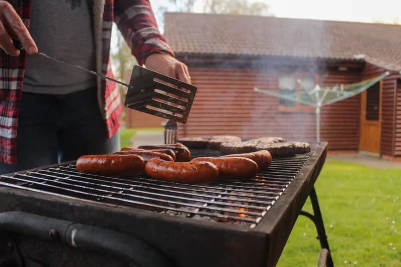 A grill going with food on the grate