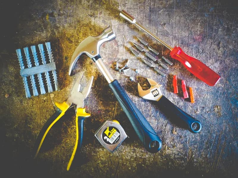 A tool kit laid out on a workbench